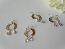 Load image into Gallery viewer, variations of crescent earrings with gemstones. 