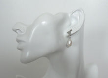 Load image into Gallery viewer, Pearl drop earrings, sustainable scrap metal  jewelry on a mannequin.