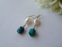 Load image into Gallery viewer, Pair of earrings with green beads and pearls on a white surface