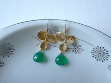 Load image into Gallery viewer, Gold earrings with green drops on a decorative plate