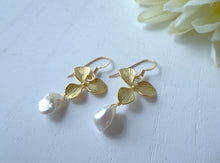 Load image into Gallery viewer, Gold leaf earrings with pearl drops on a white background