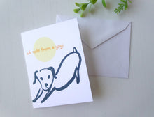 Load image into Gallery viewer, Greeting card with a dog illustration and 'A note from a yogi' text, accompanied by an envelope on a light gray background.