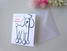 Load image into Gallery viewer, Greeting card with a dog illustration and 'You're fabulous!' text, accompanied by a white envelope on a light background.