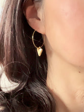 Load image into Gallery viewer, Gold heart hoop earrings on wearing photo