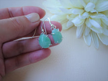 Load image into Gallery viewer, asymmetric design green jade earrings on hand