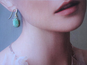 green jade earrings on model